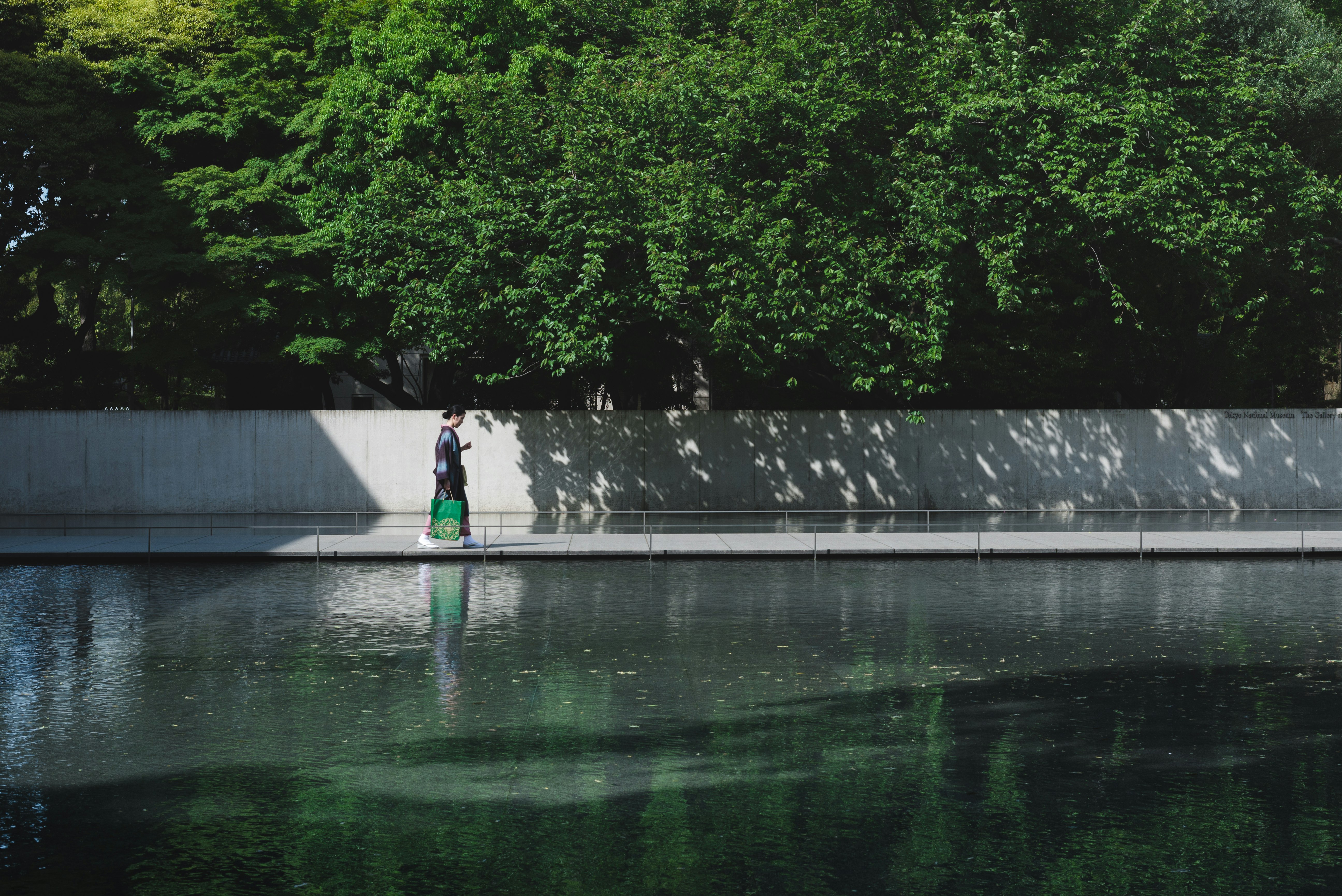 man walking on siidewalk